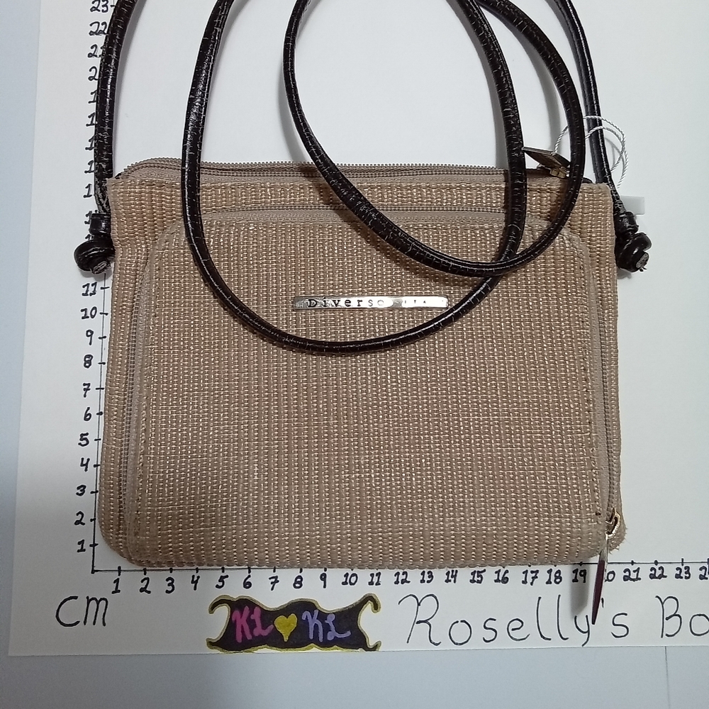 Diverso Italy. Canvas feel main bag, leather insides and strap.